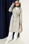 Double-breasted trench coat with epaulets, light green.