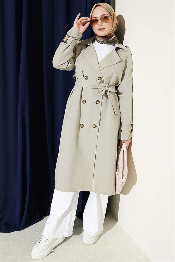 Double-breasted trench coat with epaulets, light green.