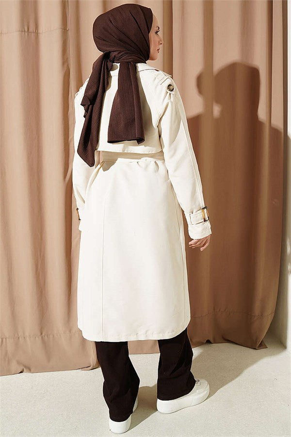 Double-breasted trench coat with epaulets