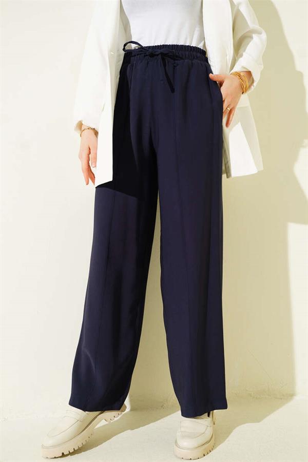 Wide-leg trousers with elasticated waistband, navy blue.