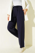 Wide-leg trousers with elasticated waistband, navy blue.