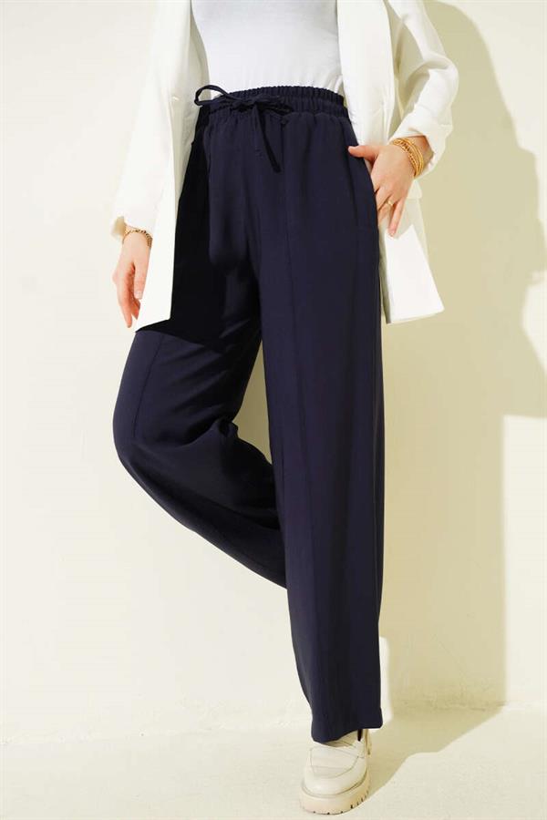 Wide-leg trousers with elasticated waistband, navy blue.