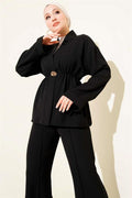 2 Piece Set in black with elastic waistband and gold accessories.