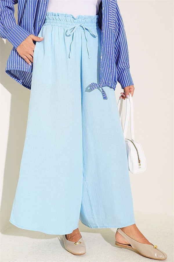 Loose-fitting muslin trousers with elastic waistband, blue.