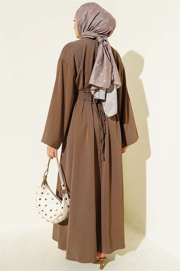 Mink-colored dress with darts and strap detail.