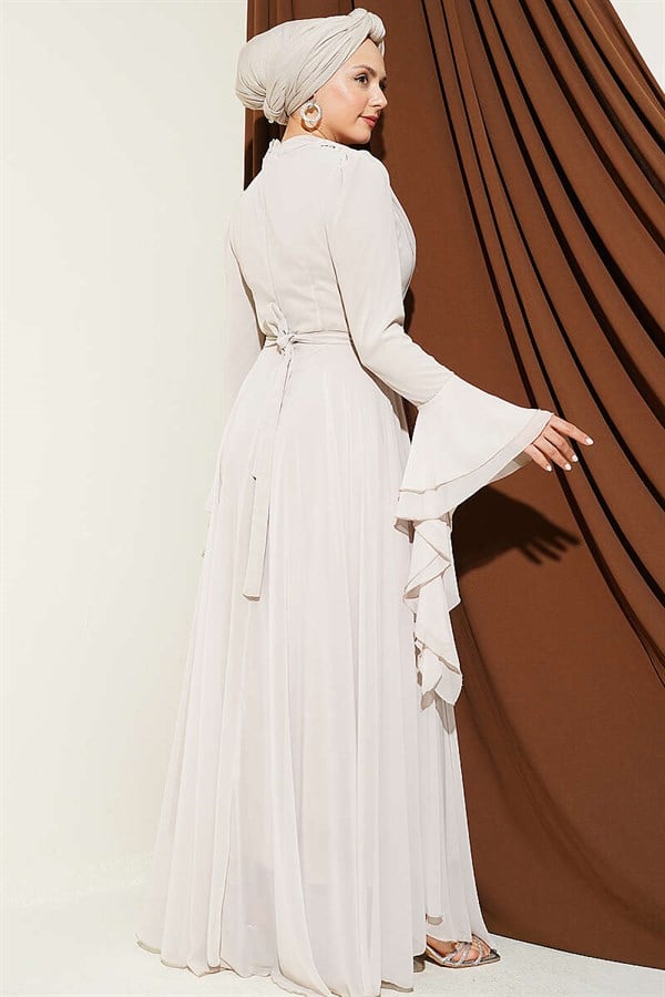 Waist-embellished, V-neck chiffon evening dress with rhinestones.