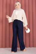 Wide-leg trousers with elasticated waist, navy blue.