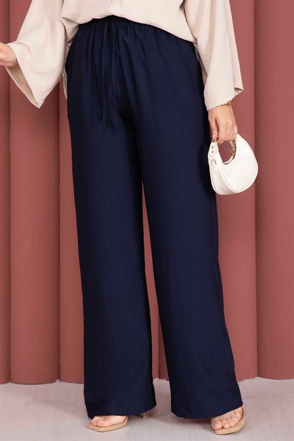 Wide-leg trousers with elasticated waist, navy blue.