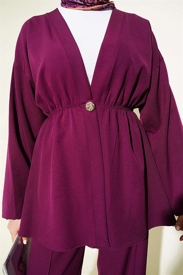 2 Piece Set with elasticated waist and gold buttons, in plum color.