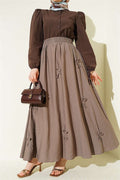 Mink-colored skirt with elasticated waist and ribbon detail.