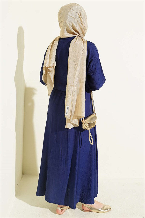 Button-down, front-tie skirt two-piece set in navy blue.