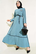 Blue Dress with Floral Accessory and Piping Detail