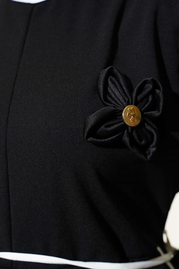 Black Dress with Floral Accessory and Piping Detail