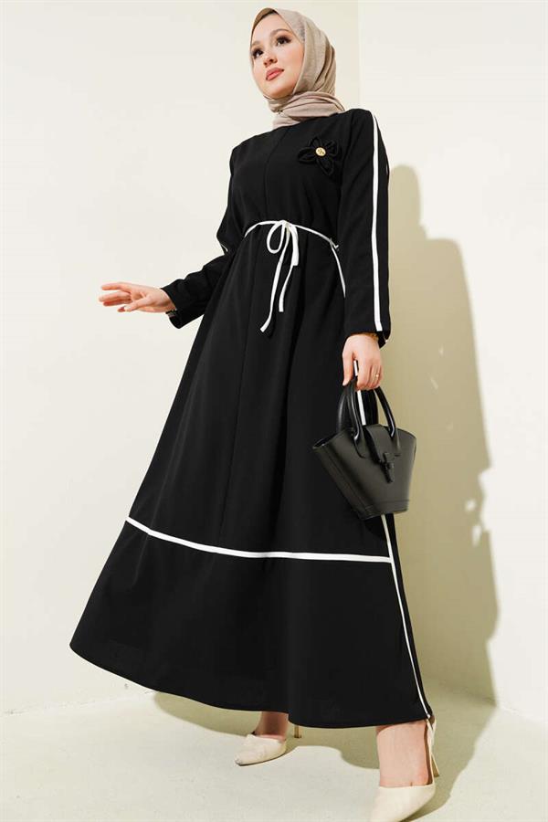 Black Dress with Floral Accessory and Piping Detail