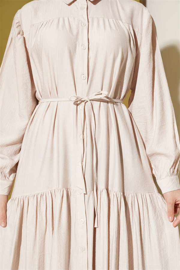 Button-down, lace-up dress in beige.