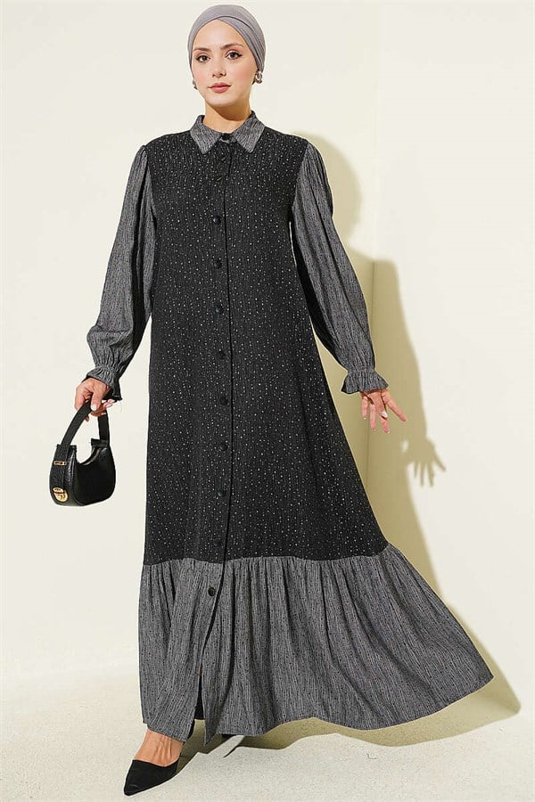 Loose-fitting, button-down dress in black.