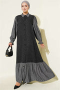 Loose-fitting, button-down dress in black.
