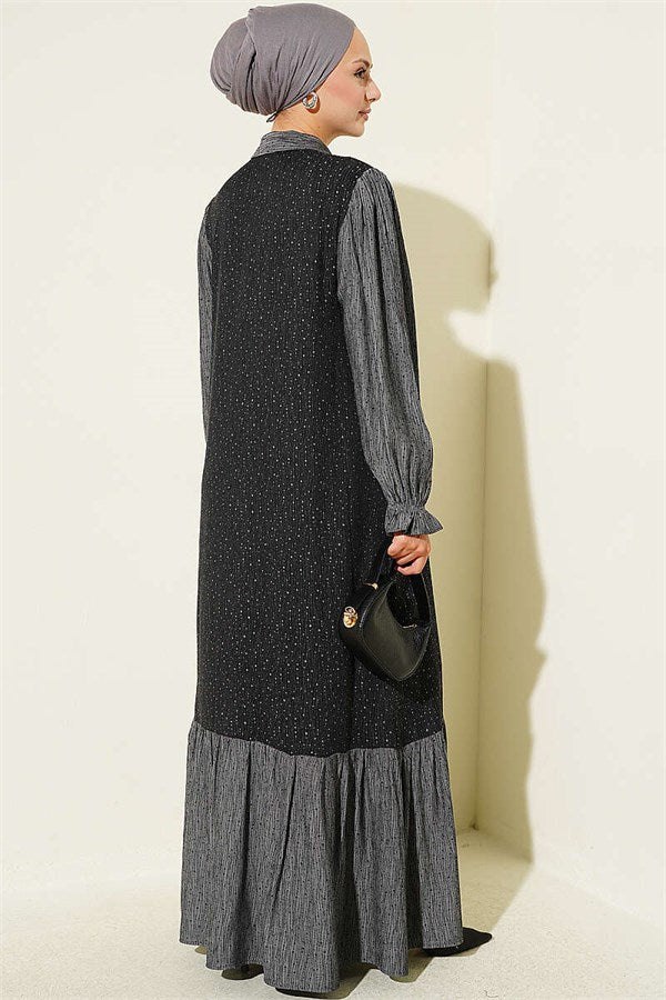 Loose-fitting, button-down dress in black.