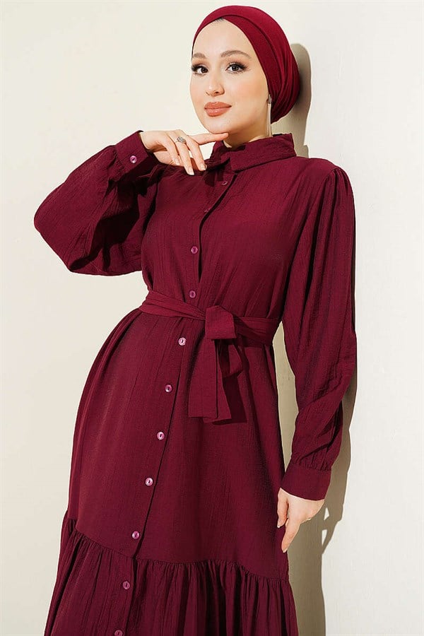 Button-down, ruffled, belted dress in burgundy.