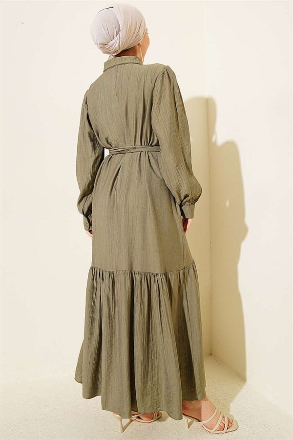 Button-down, ruffled, belted dress in khaki.