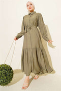 Button-down, ruffled, belted dress in khaki.