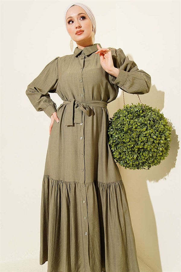 Button-down, ruffled, belted dress in khaki.