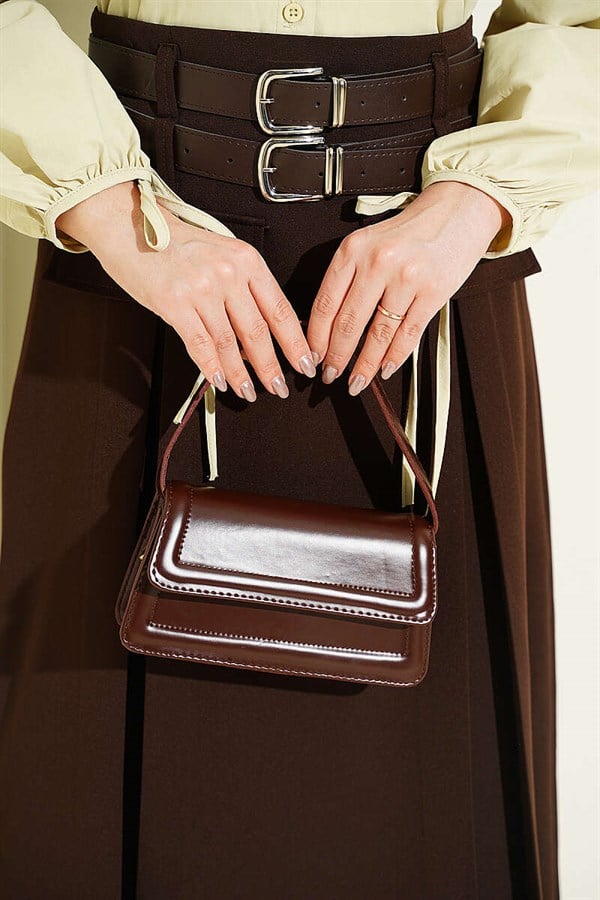 Double-belted dart-detailed flared skirt in brown.