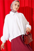 Loose-fitting shirt with tunnel hem, white.