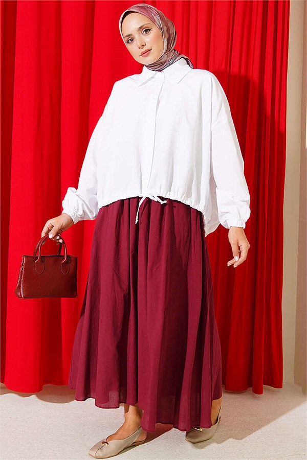 Loose-fitting shirt with tunnel hem, white.