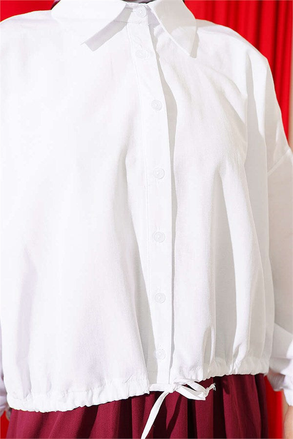 Loose-fitting shirt with tunnel hem, white.