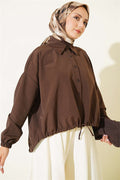 Loose-fitting shirt with tunnel hem, brown.