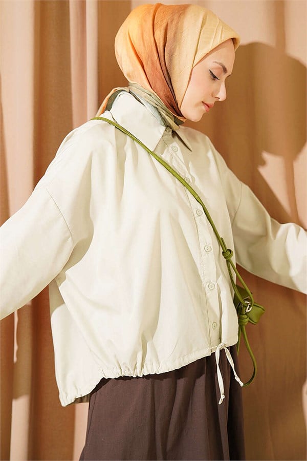 Loose-fitting shirt with tunnel hem, aqua green.