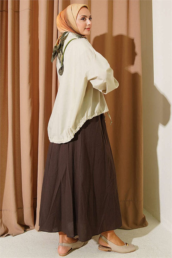 Loose-fitting shirt with tunnel hem, aqua green.
