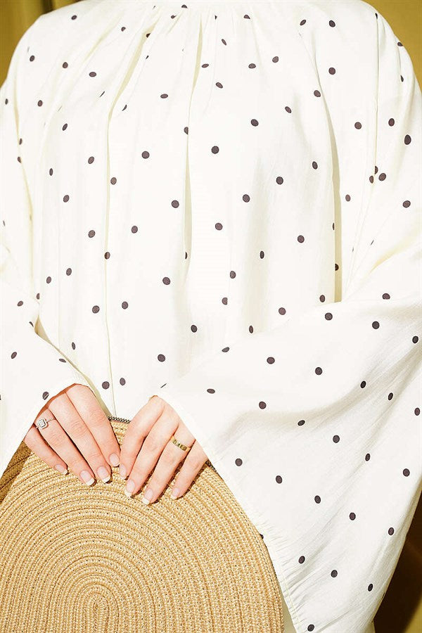 Loose-fitting tunic with wide sleeves and polka dots, yellow.