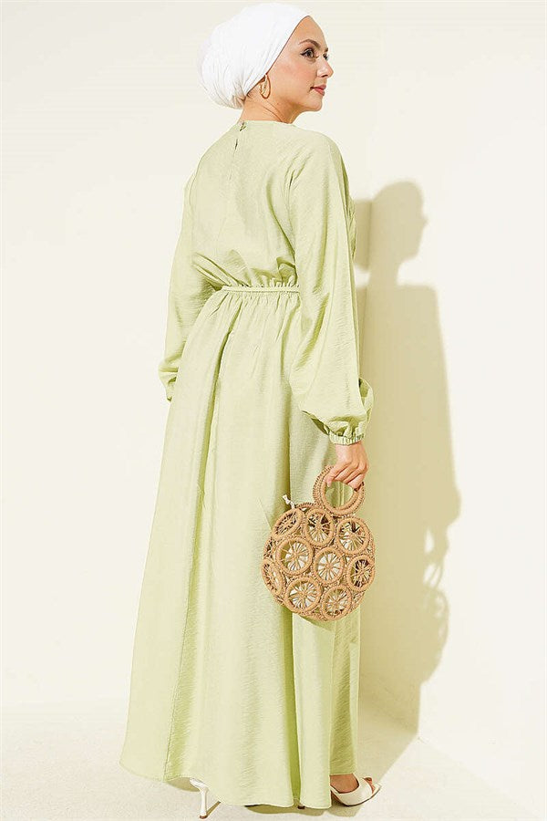 Light Green Dress with Ruffle Detail and Strappy Belt