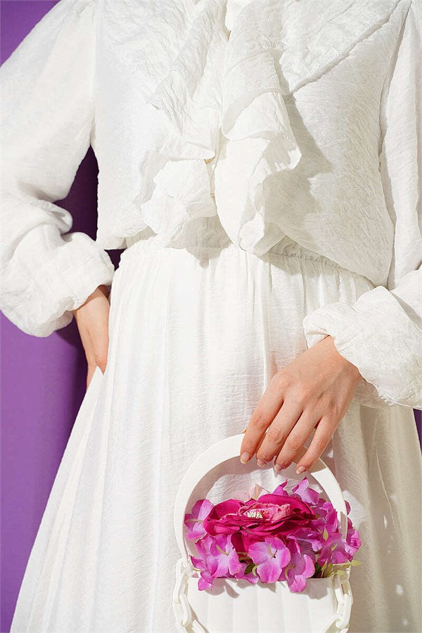 Two-piece set with ruffled skirt and gold button detail, ecru.