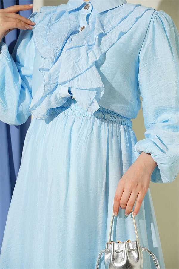 Two-piece set with gold button detail and ruffled skirt, baby blue.