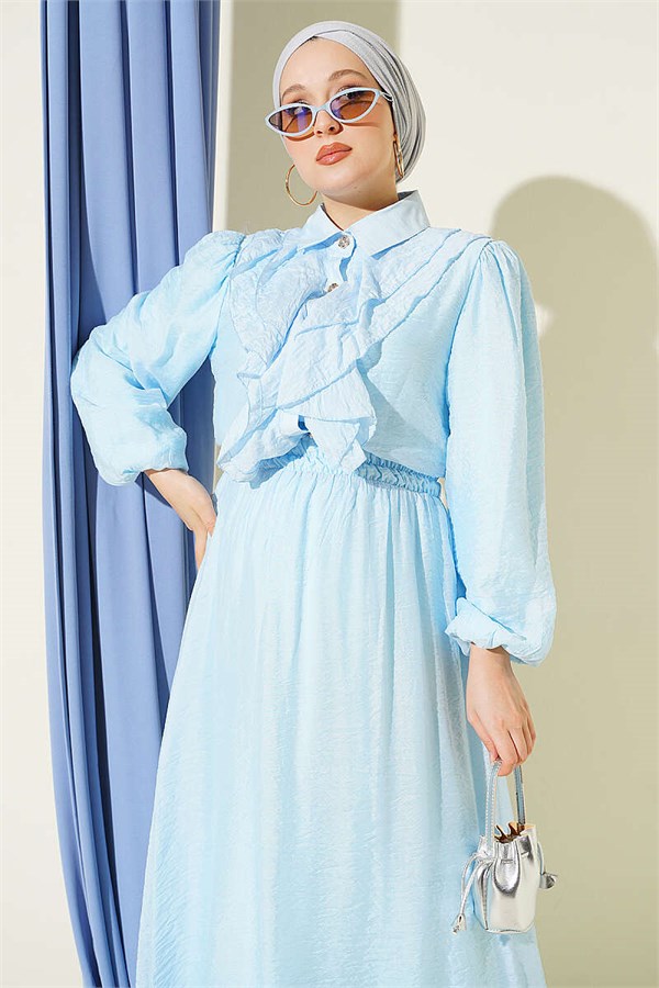Two-piece set with gold button detail and ruffled skirt, baby blue.
