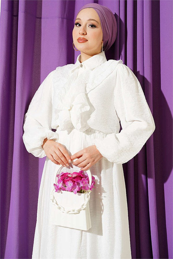 Two-piece set with ruffled skirt and gold button detail, ecru.