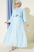 Two-piece set with gold button detail and ruffled skirt, baby blue.