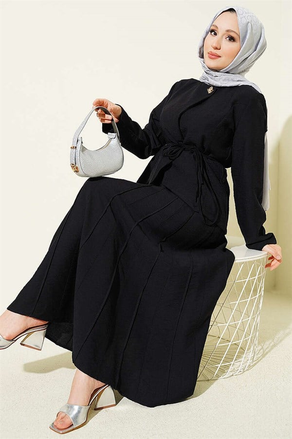 2 Piece Set in black with gold buttons, belt, and pleated skirt.
