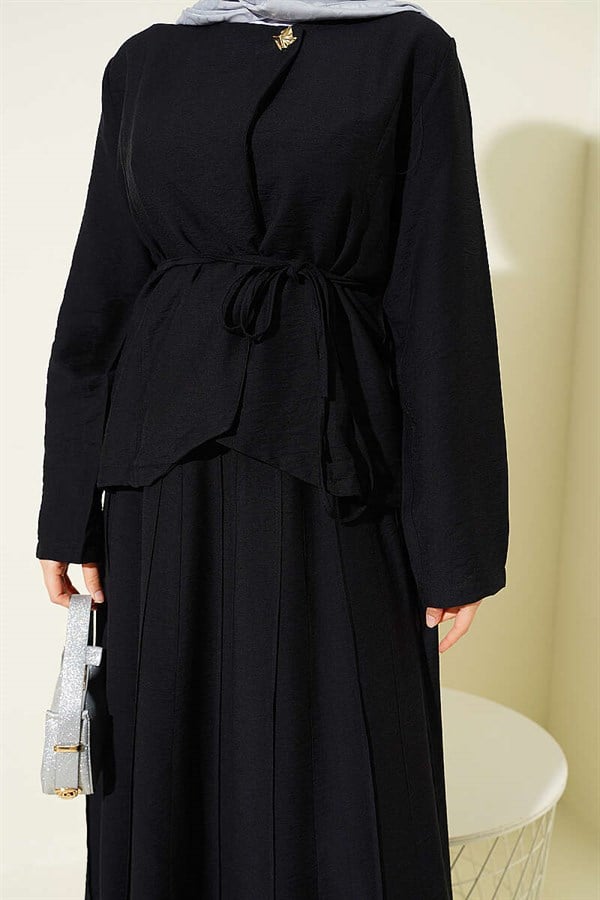 2 Piece Set in black with gold buttons, belt, and pleated skirt.