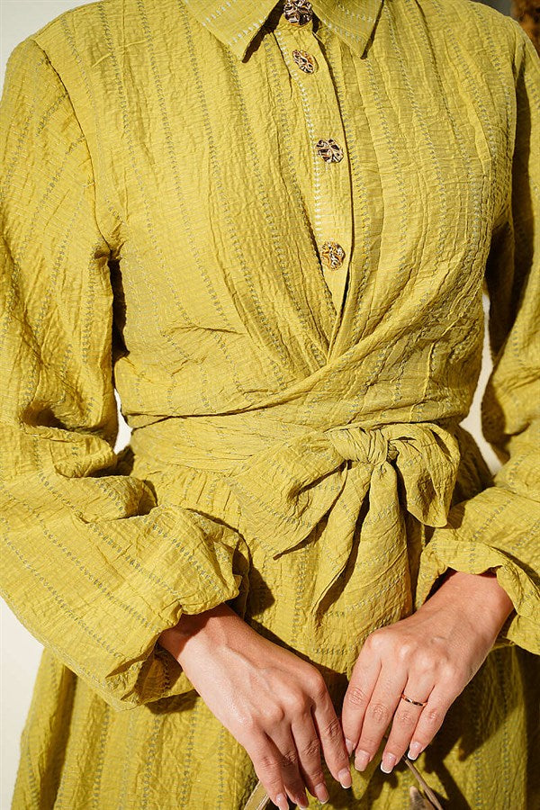 2 Piece Set with gold buttons and front-tie skirt in olive green.