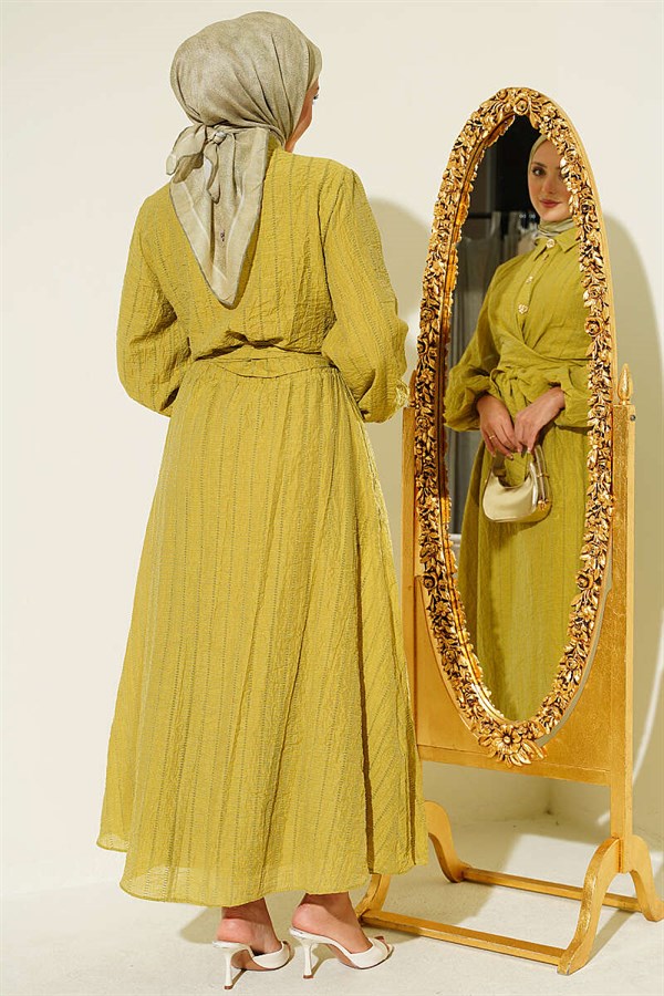 2 Piece Set with gold buttons and front-tie skirt in olive green.