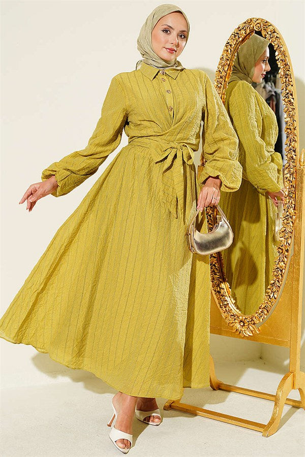 2 Piece Set with gold buttons and front-tie skirt in olive green.