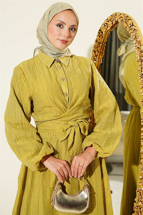 2 Piece Set with gold buttons and front-tie skirt in olive green.