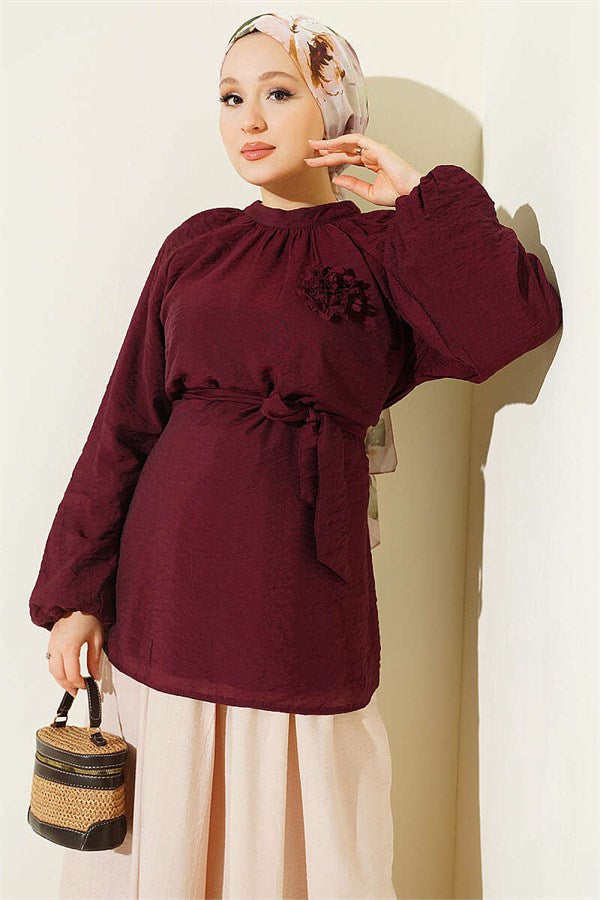 Burgundy Tunic with Rose Brooch and Belted Waist