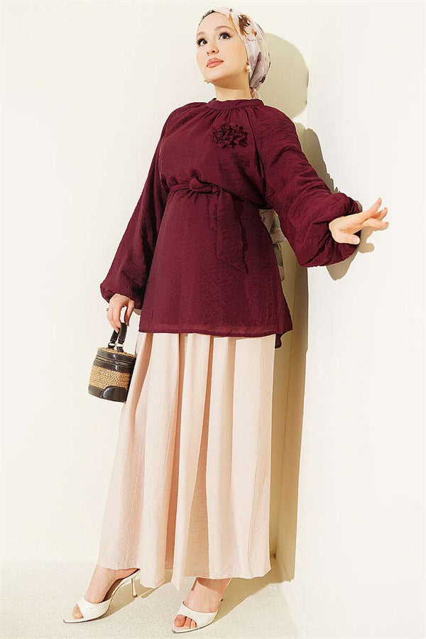 Burgundy Tunic with Rose Brooch and Belted Waist