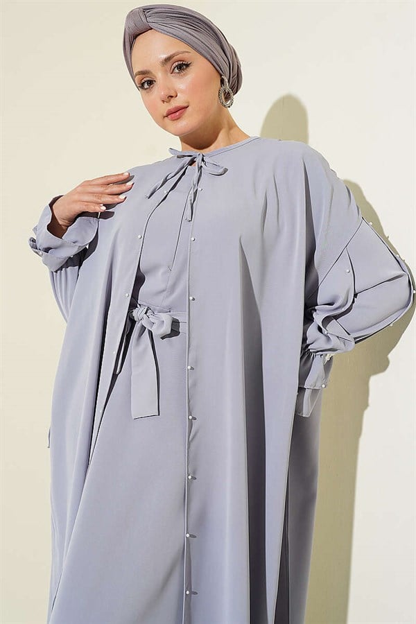 Gray Dress with Pearl Embellishments and Butterfly Cape