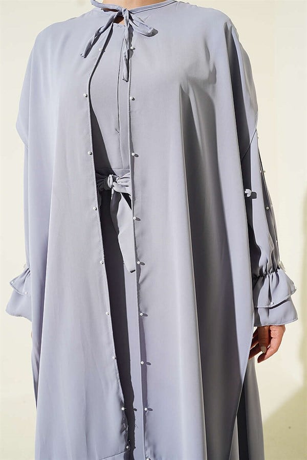 Gray Dress with Pearl Embellishments and Butterfly Cape